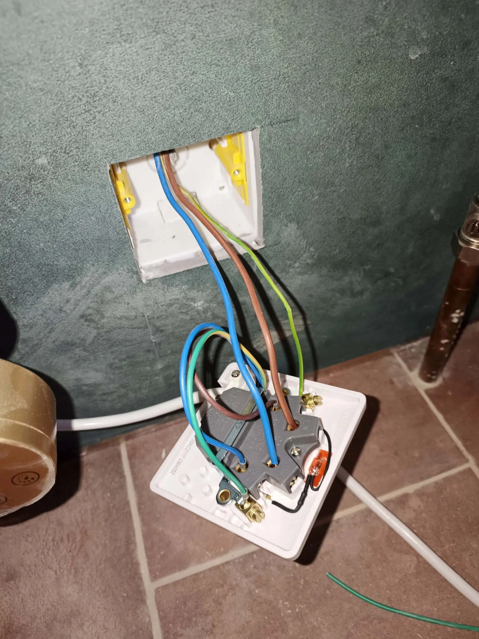 Wiring the fused spur that feeds an electric towel radiator during a bathroom refurbishment in Bournemouth BH5