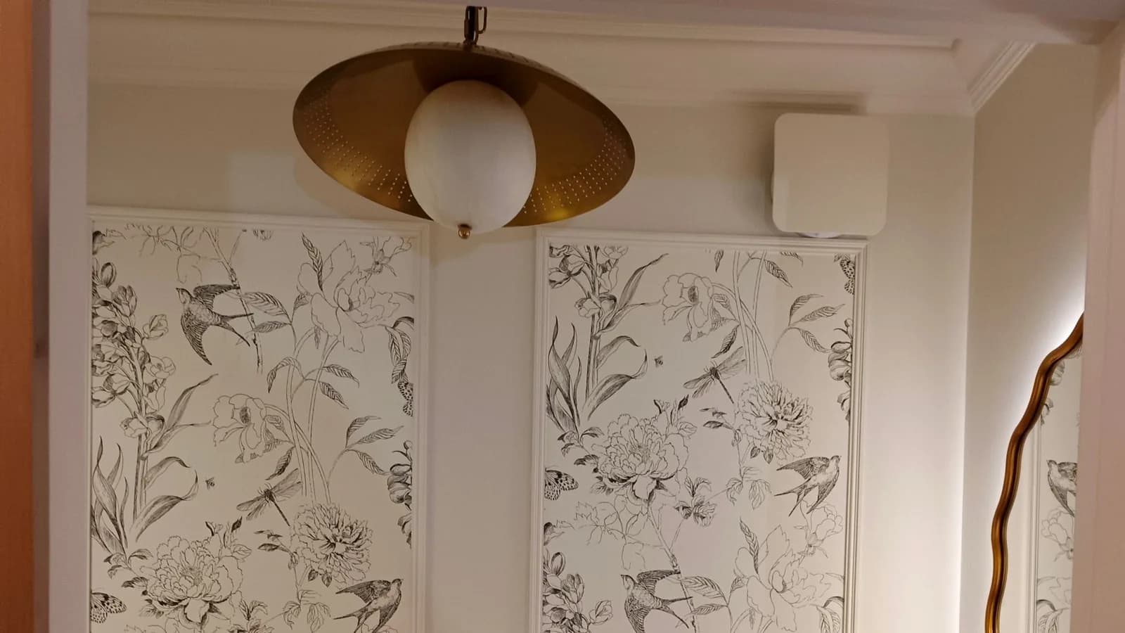 Cloakroom in Penn Hill, Poole BH14 with a brass pendant light, timed extractor fan and backlit mirror