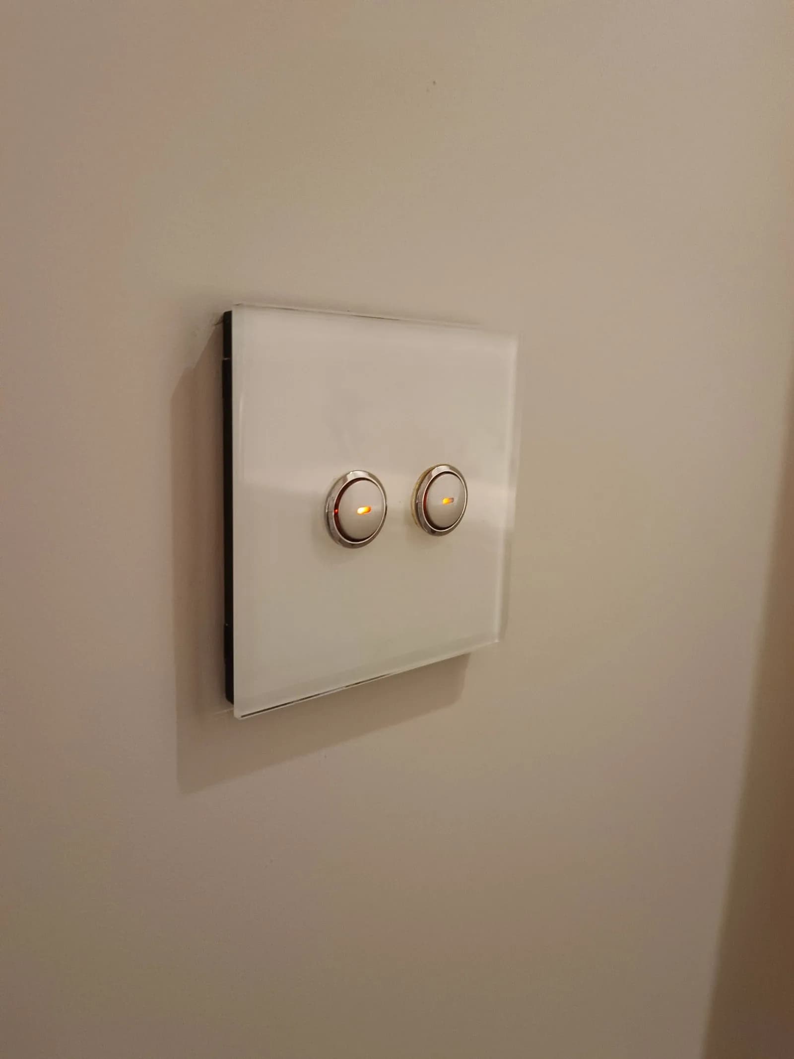 White glass two-gang push-button light switch with indicator lights, Poole BH14