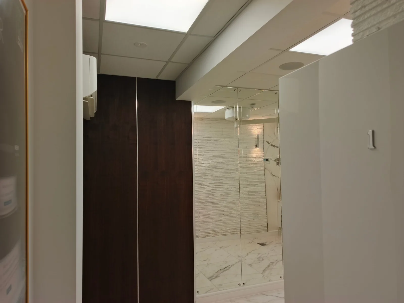 Suspended ceiling with recessed lighting in a clinic corridor, Poole BH14