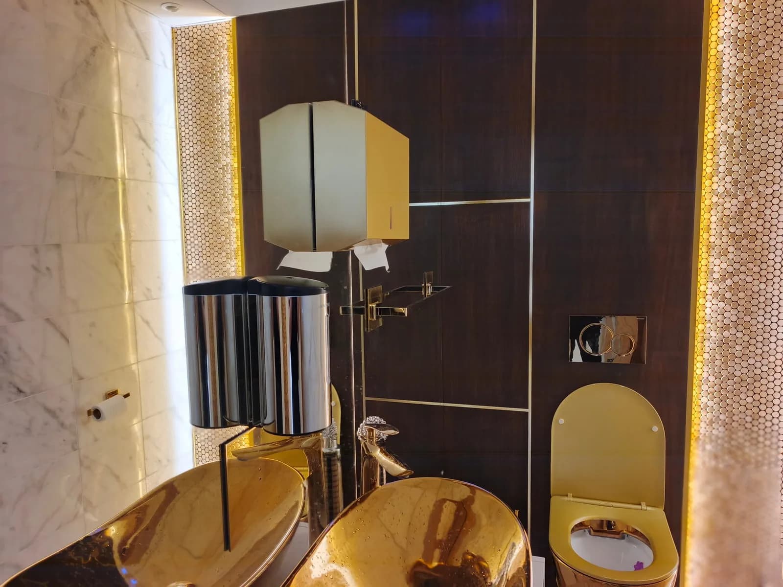 Clinic WC with walnut panelling, illuminated mosaic panel and gold basins, Poole BH14