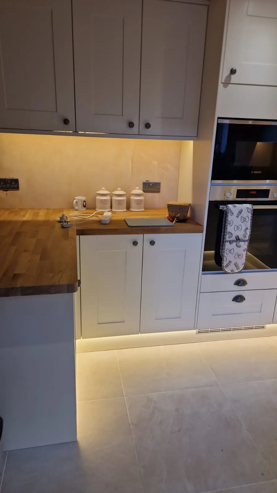 Double sockets and appliance feeds beside the worktop in a Bournemouth BH9 kitchen