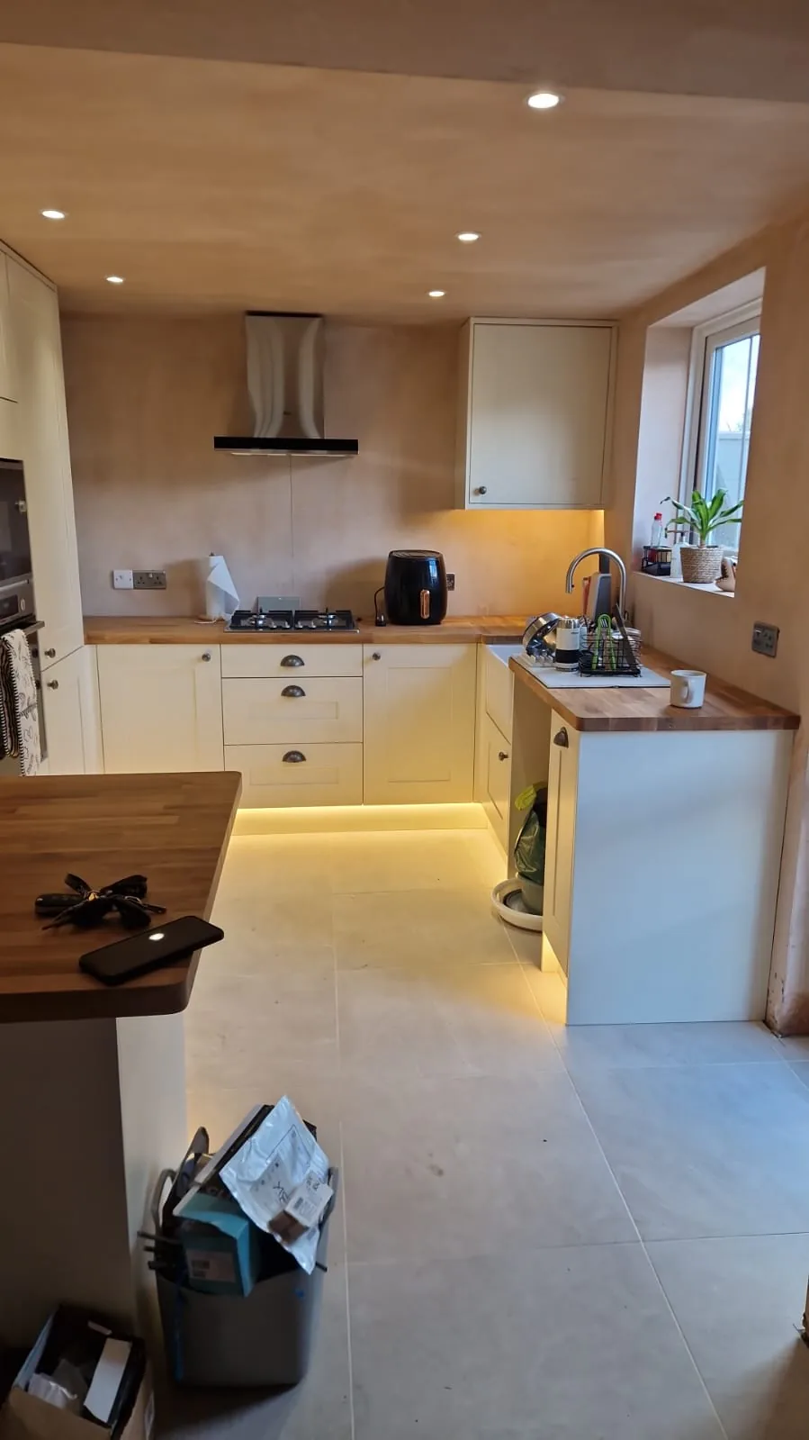 Completed kitchen electrical installation with separate under-cabinet and plinth LED lighting in Bournemouth BH9