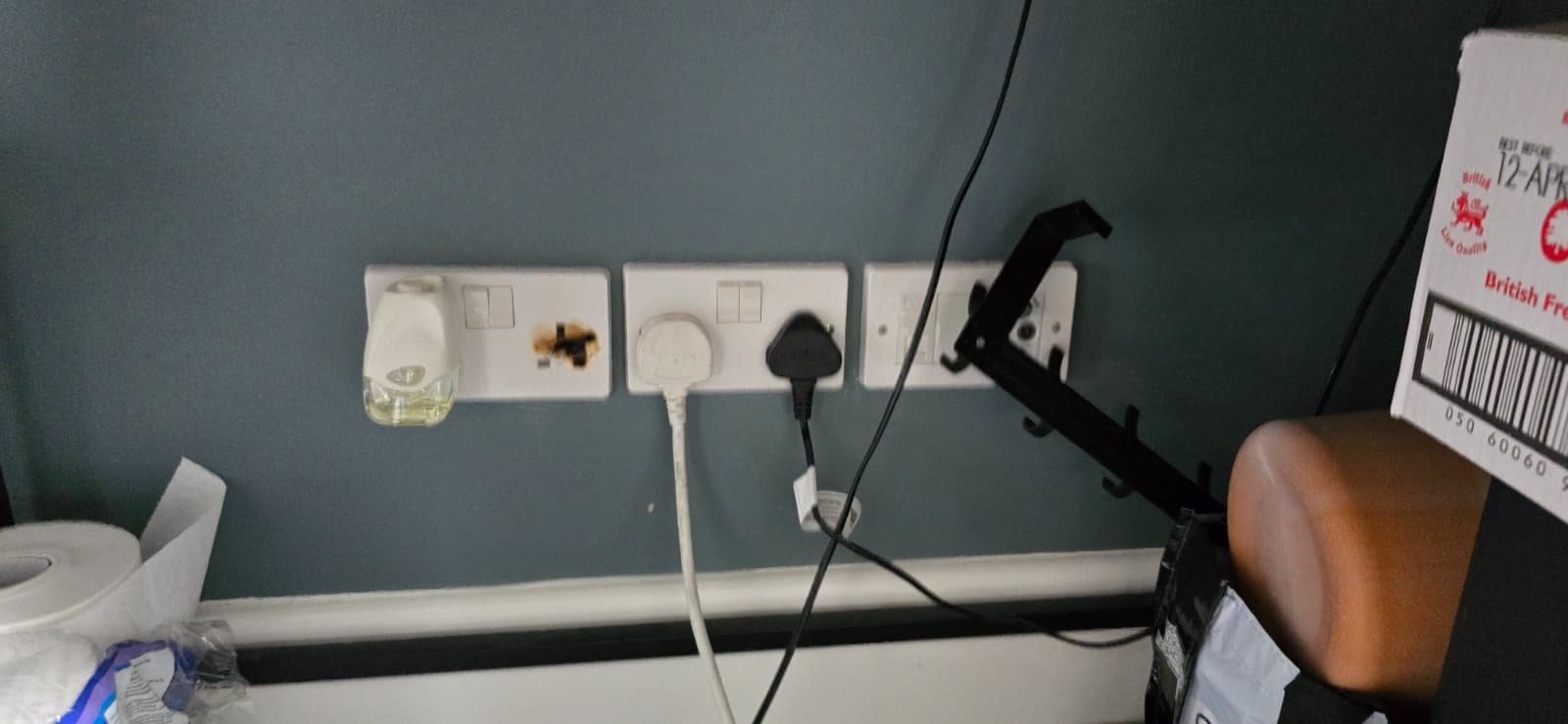 Burned socket outlet found during HMO EICR inspection in Bournemouth.