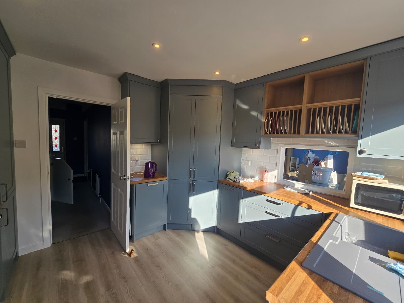 High-spec modern kitchen interior with completed ceiling spotlighting and functional layout in Bournemouth.