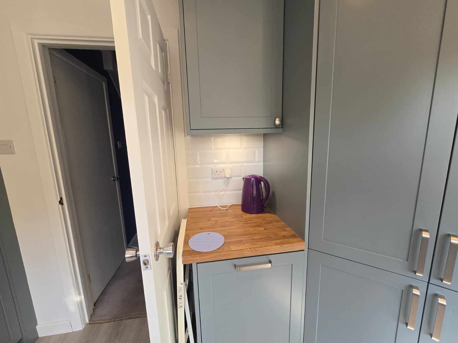 Chrome dual sockets aligned square with the tile layout over kitchen worktops.